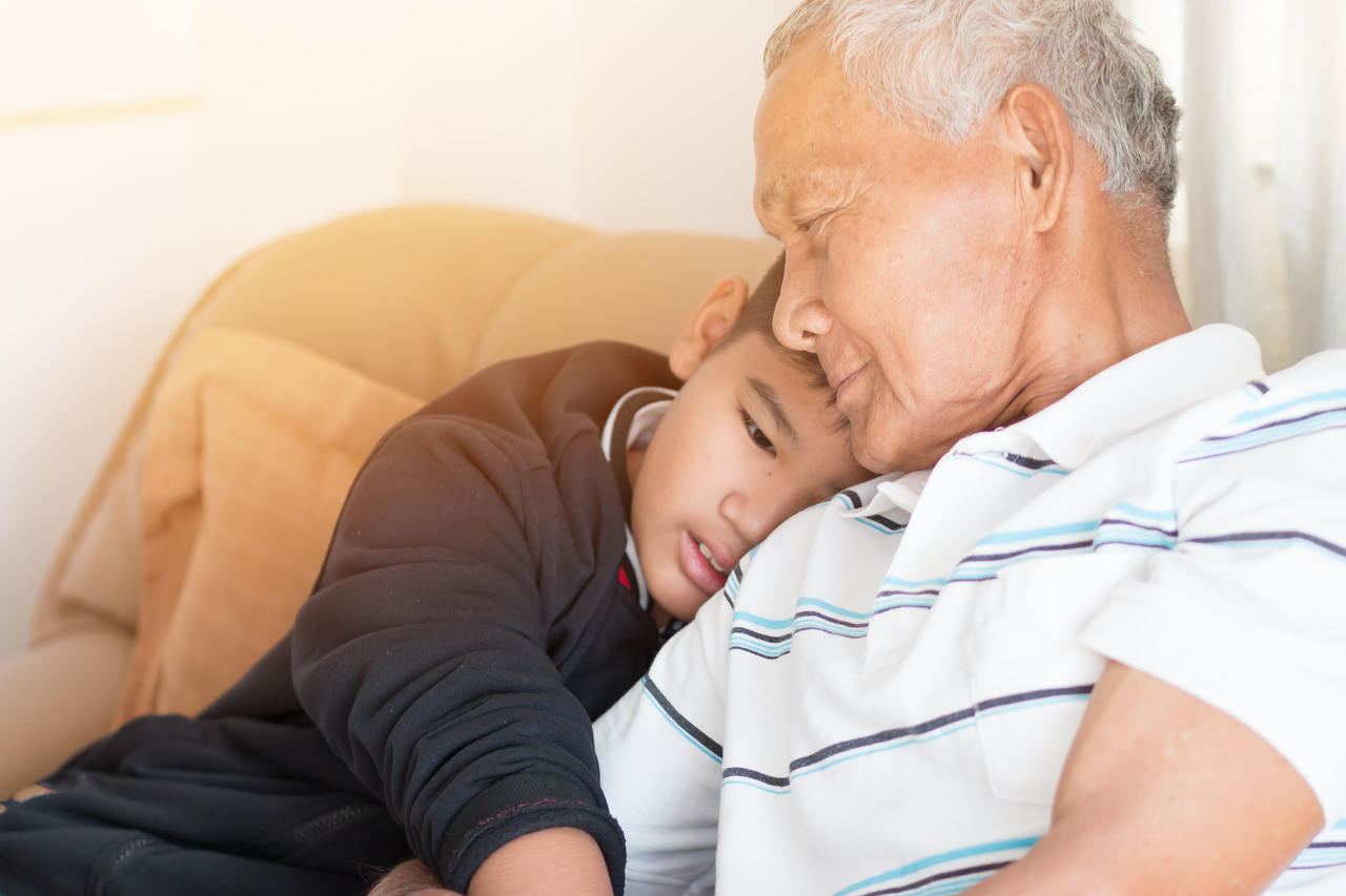 A grandchild with his grandfather after heart surgery