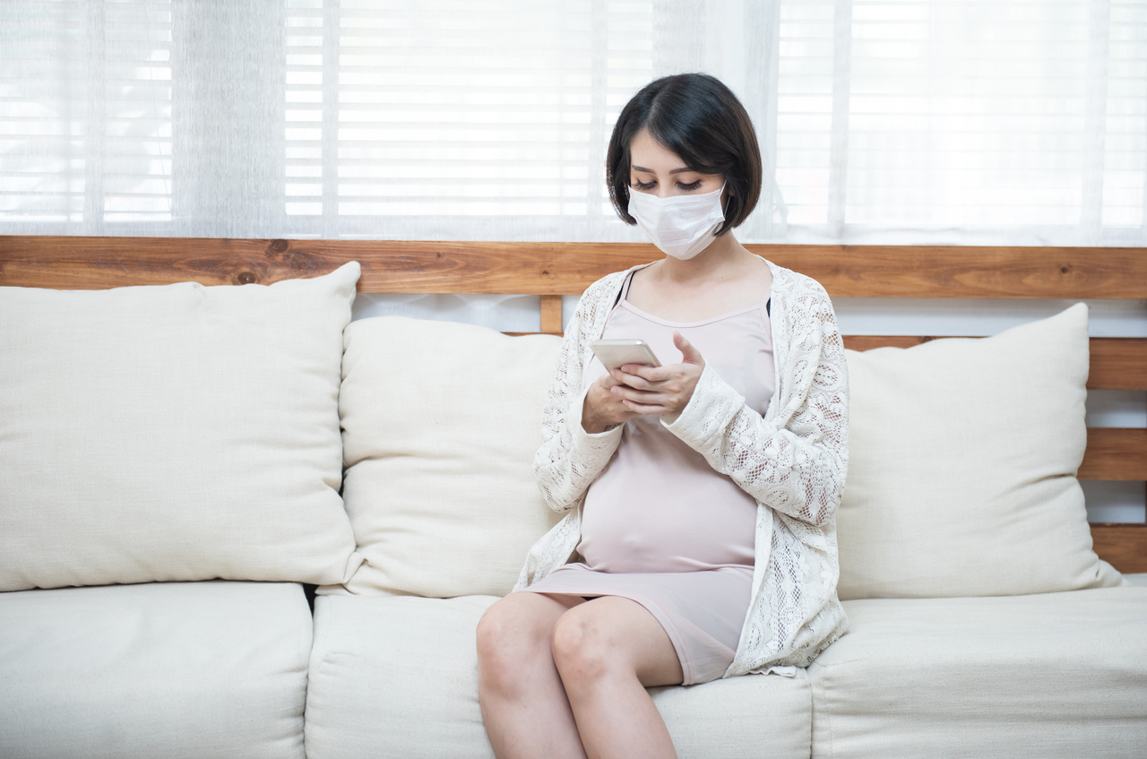 A pregnant woman staying home due to COVID-19